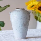 Old foam-glazed terracotta vase