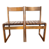 Pair of vintage sled chairs in solid pine