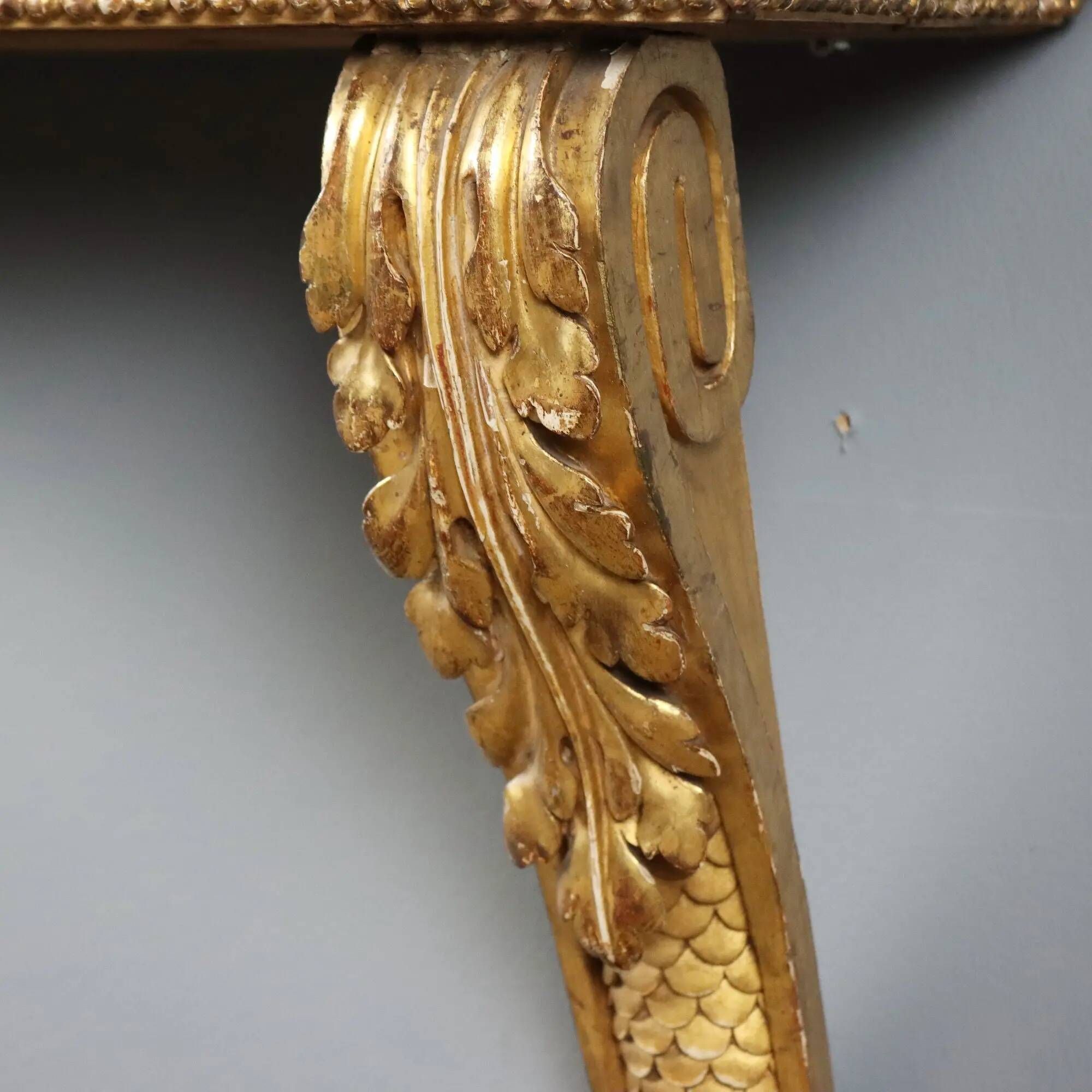 Old carved and gilded wooden console, Italy, 19th century.