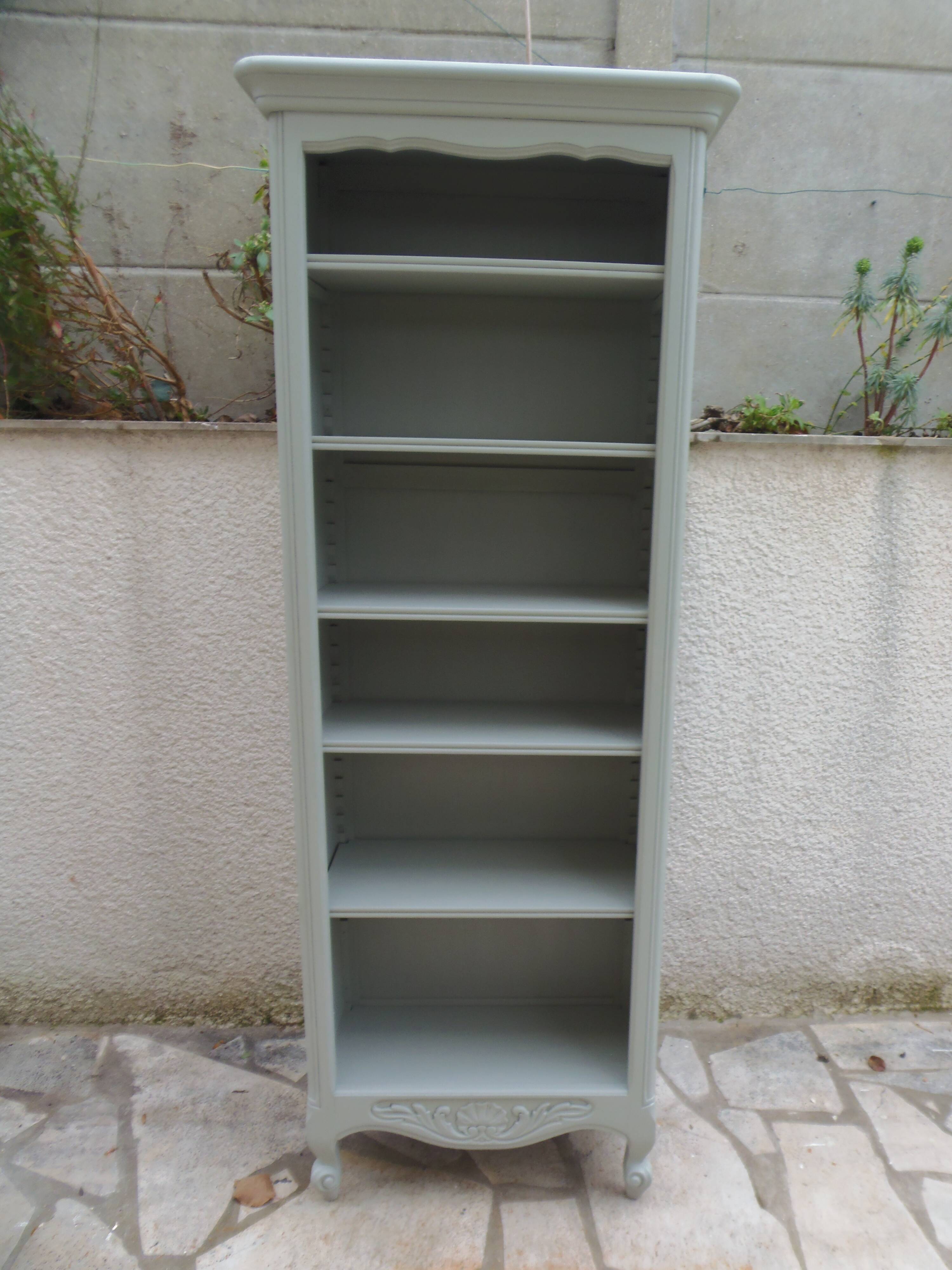 A shallow vintage bookcase re-enchanted in a verdigris finish.
