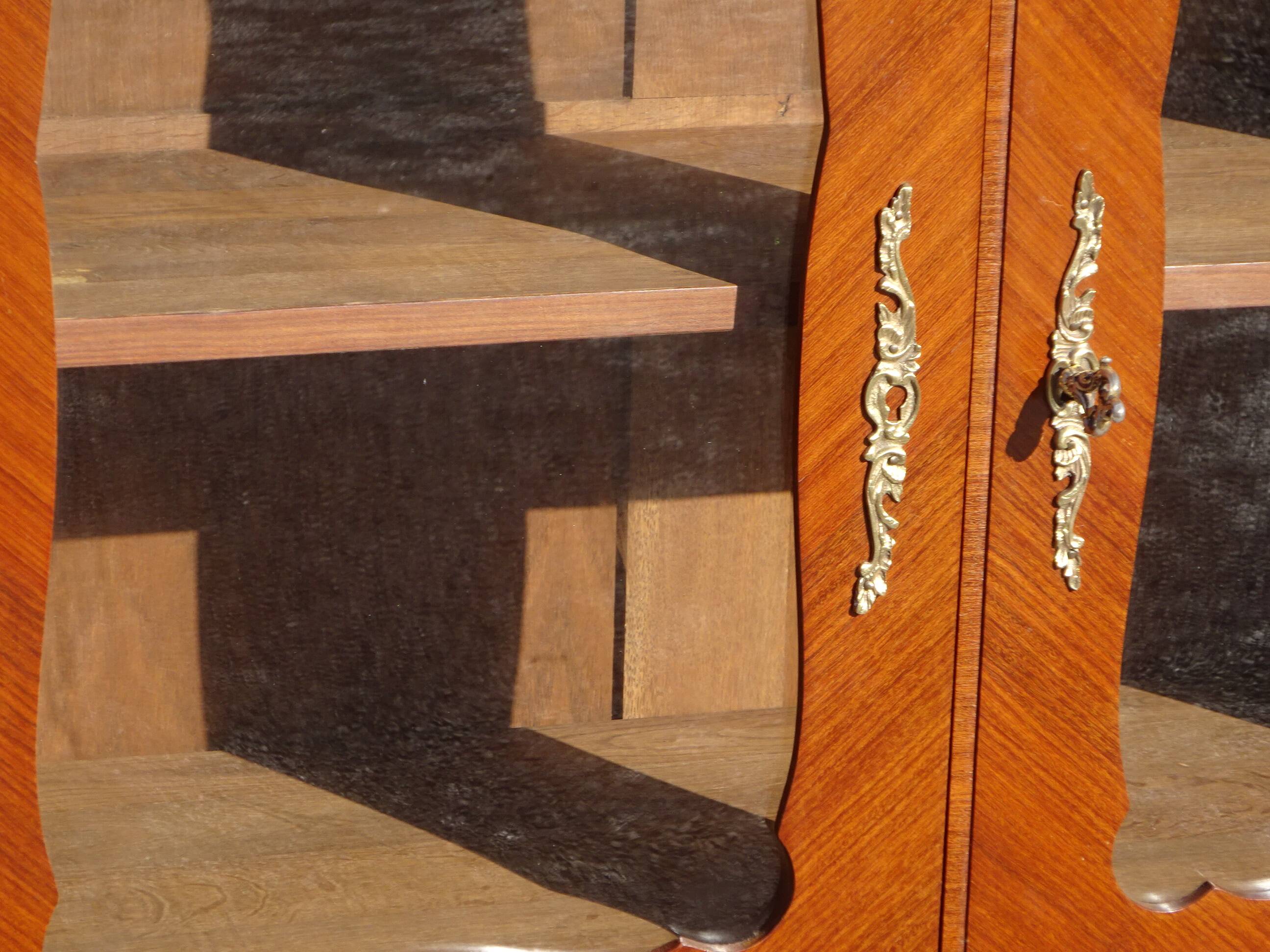 Glass library with rosewood marquetry in the Louis XV style.