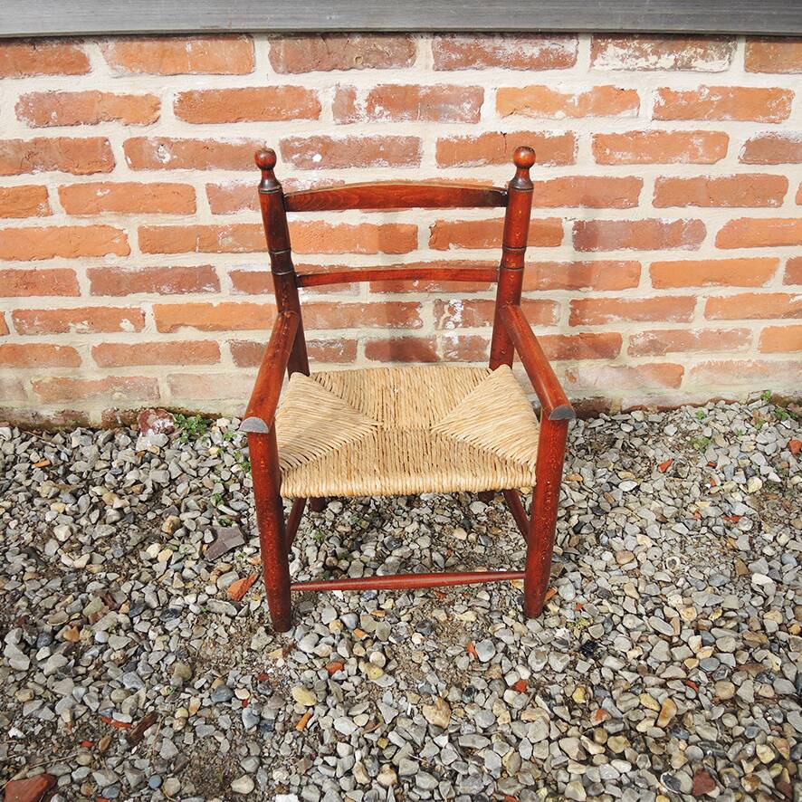 Old straw armchair for children