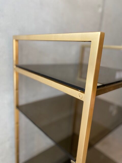 Golden brass and glass shelves
