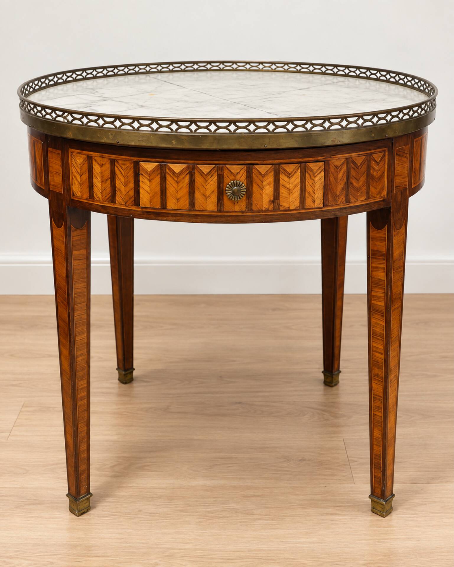 Bouillotte table in Louis XVI style with marquetry, marble, and brass.