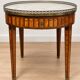 Bouillotte table in Louis XVI style with marquetry, marble, and brass.