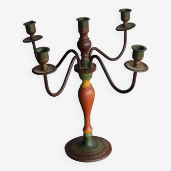 Old candlestick in painted wood and folding metal