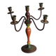 Old candlestick in painted wood and folding metal