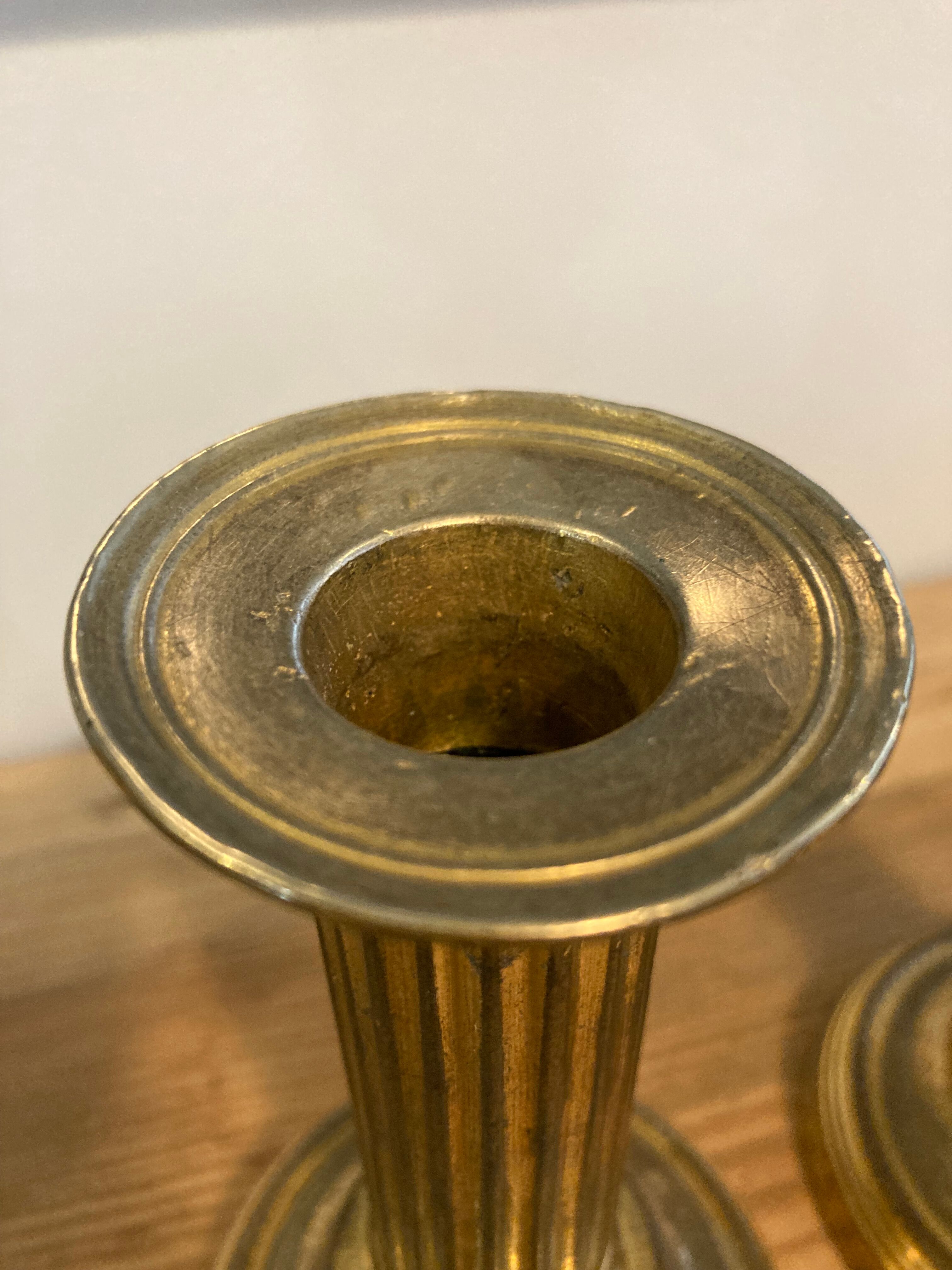 Pair of Louis XVI candlesticks in gilded bronze
