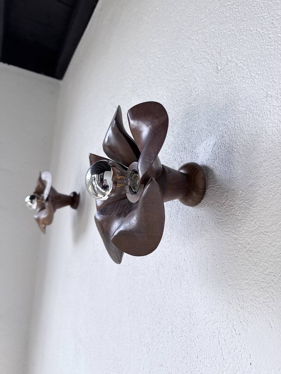 Pair of wooden flower wall lights from the 1970s.