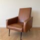 Vintage 1950s brown faux leather armchair