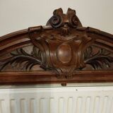 old pediment in carved walnut