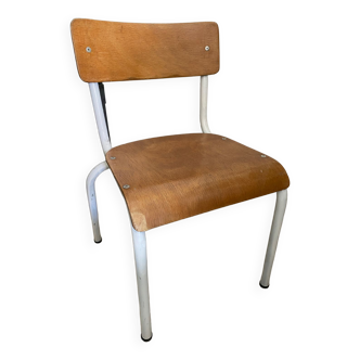 Old wooden and metal children's school chair