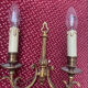 two brass wall sconces