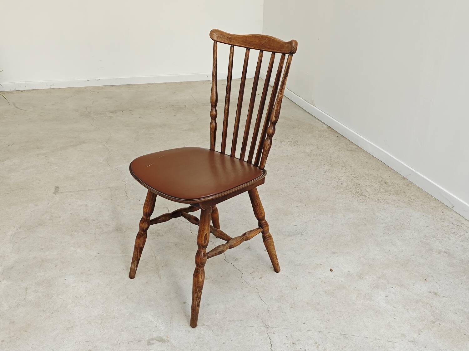 Baumann Tacoma bistro chair, wood and brown faux leather, 1960.