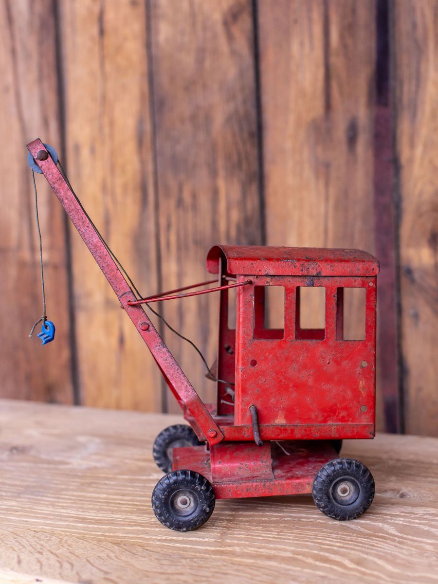 Old toy truck crane in sheet metal