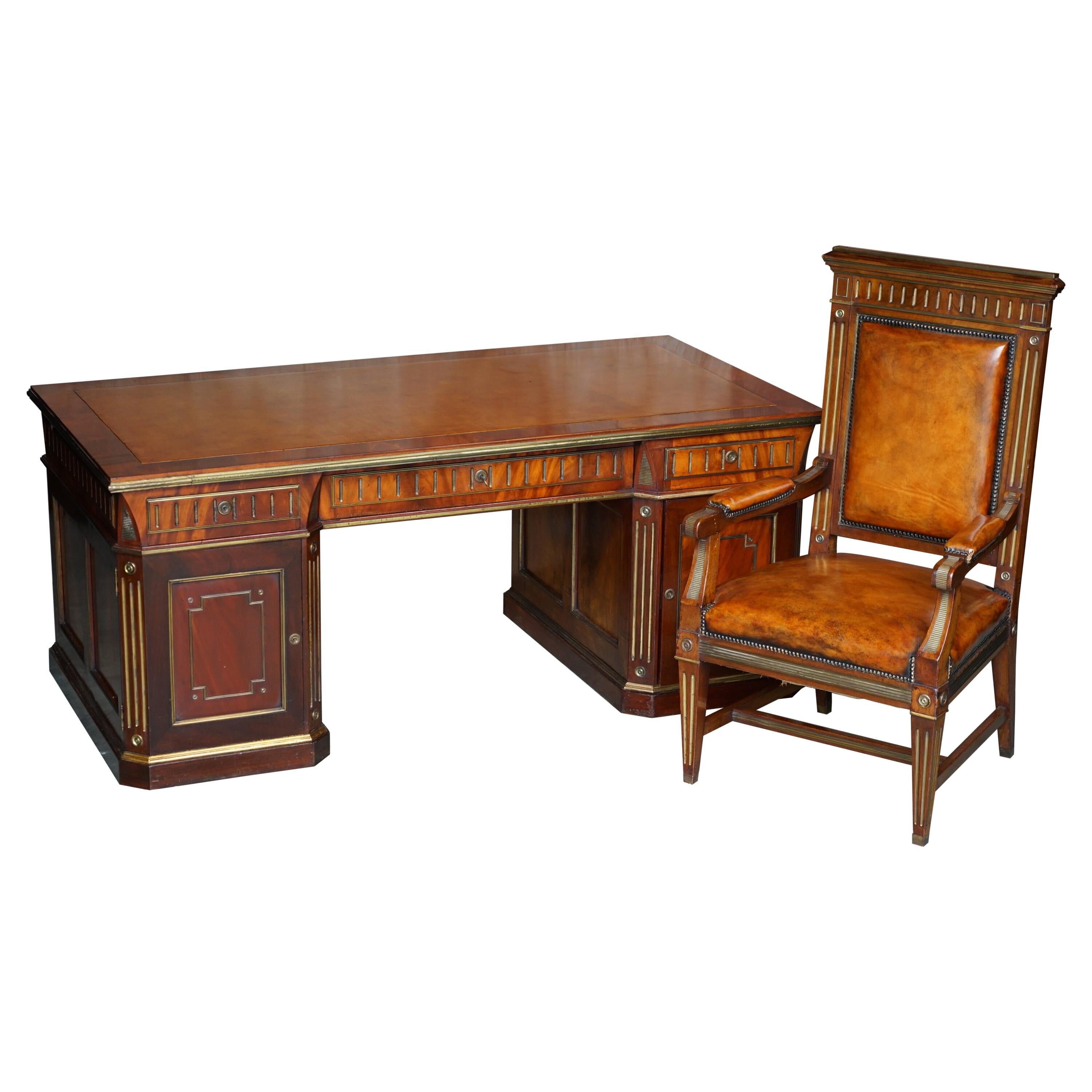 Restored antique Russian hardwood partner desk and leather armchair.