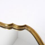 Old wooden mirror gilded with gold leaf