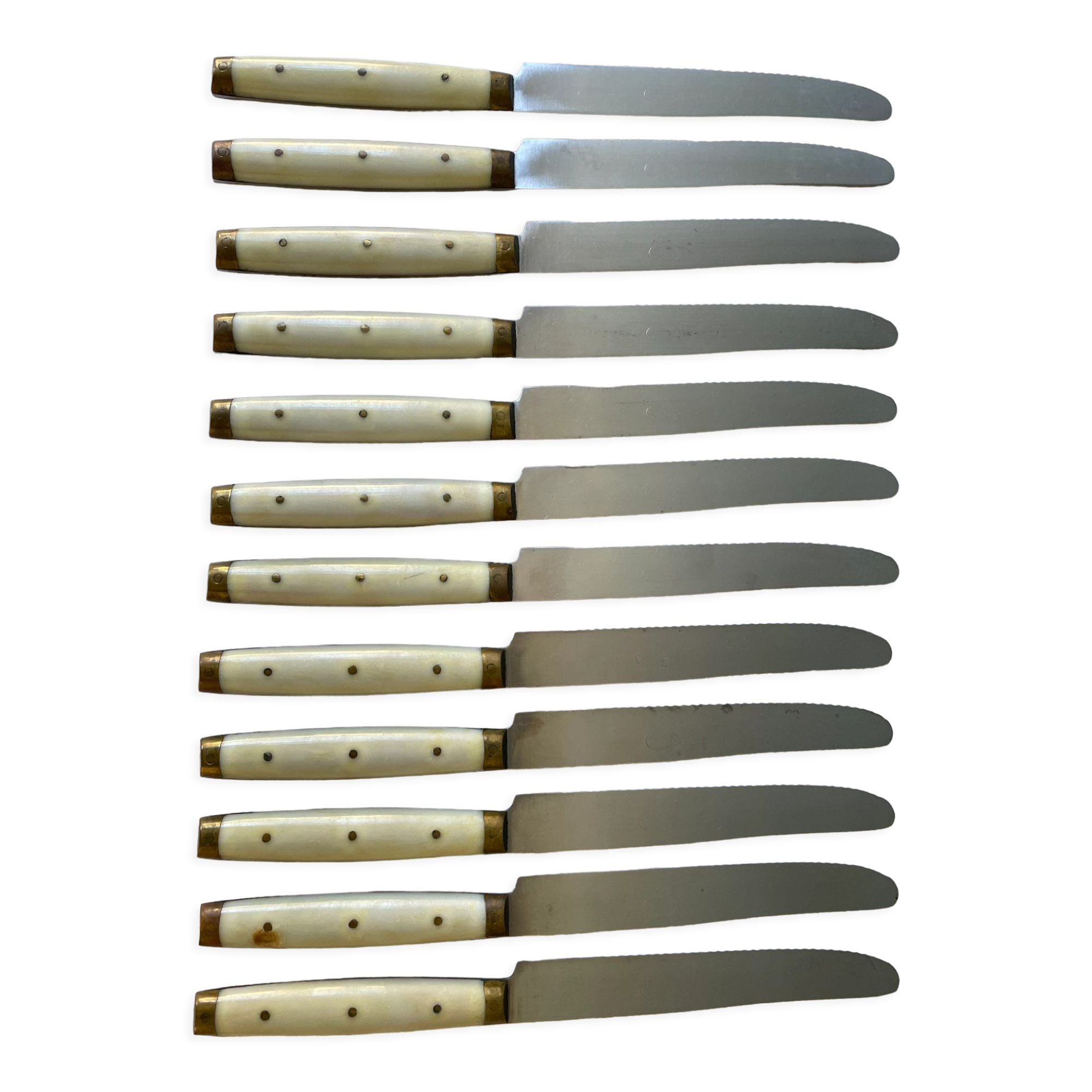 Series of 12 serrated vintage table knives