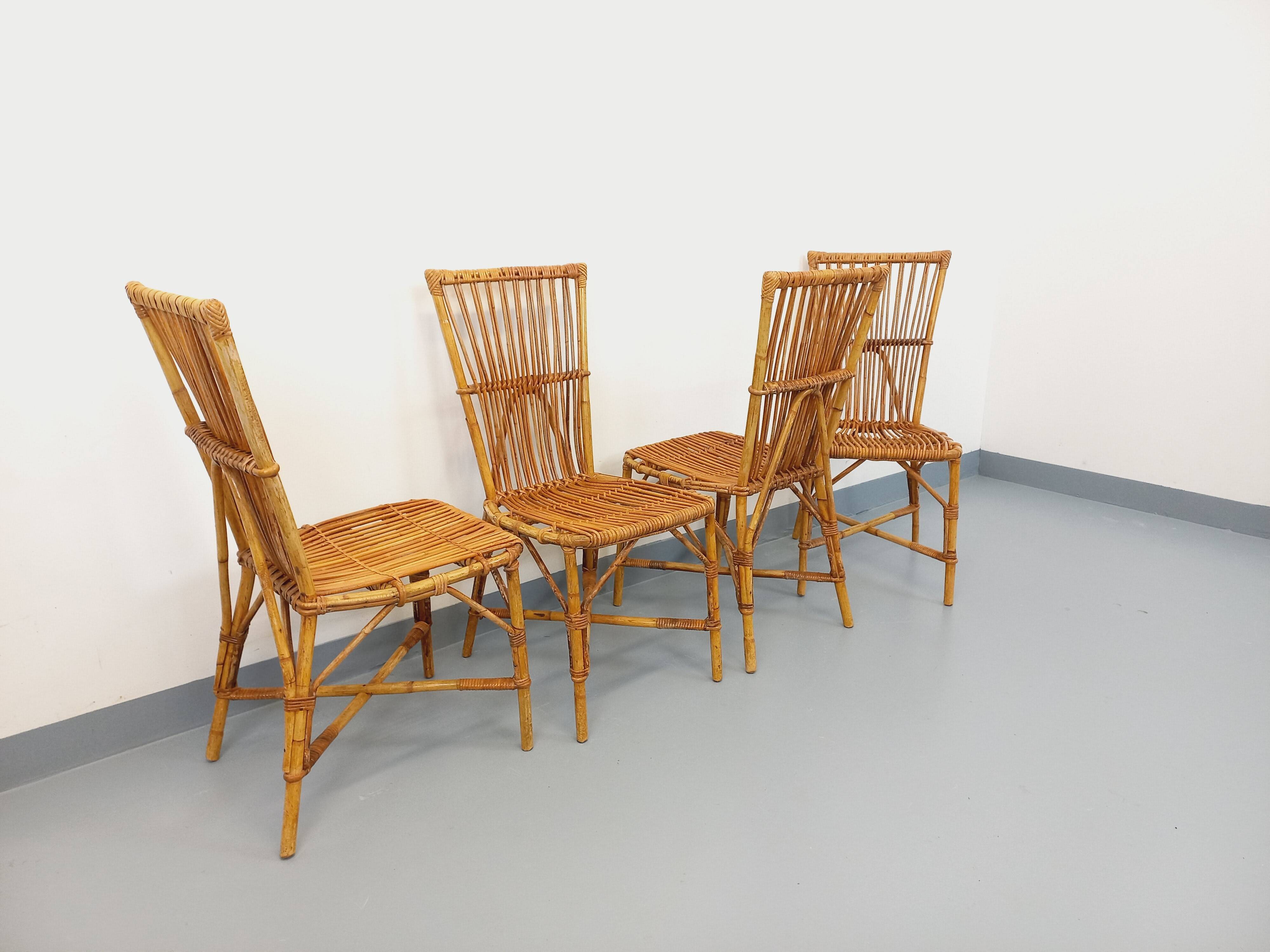 Set of 4 vintage Audoux Minet rattan chairs from the 1950s and 60s.