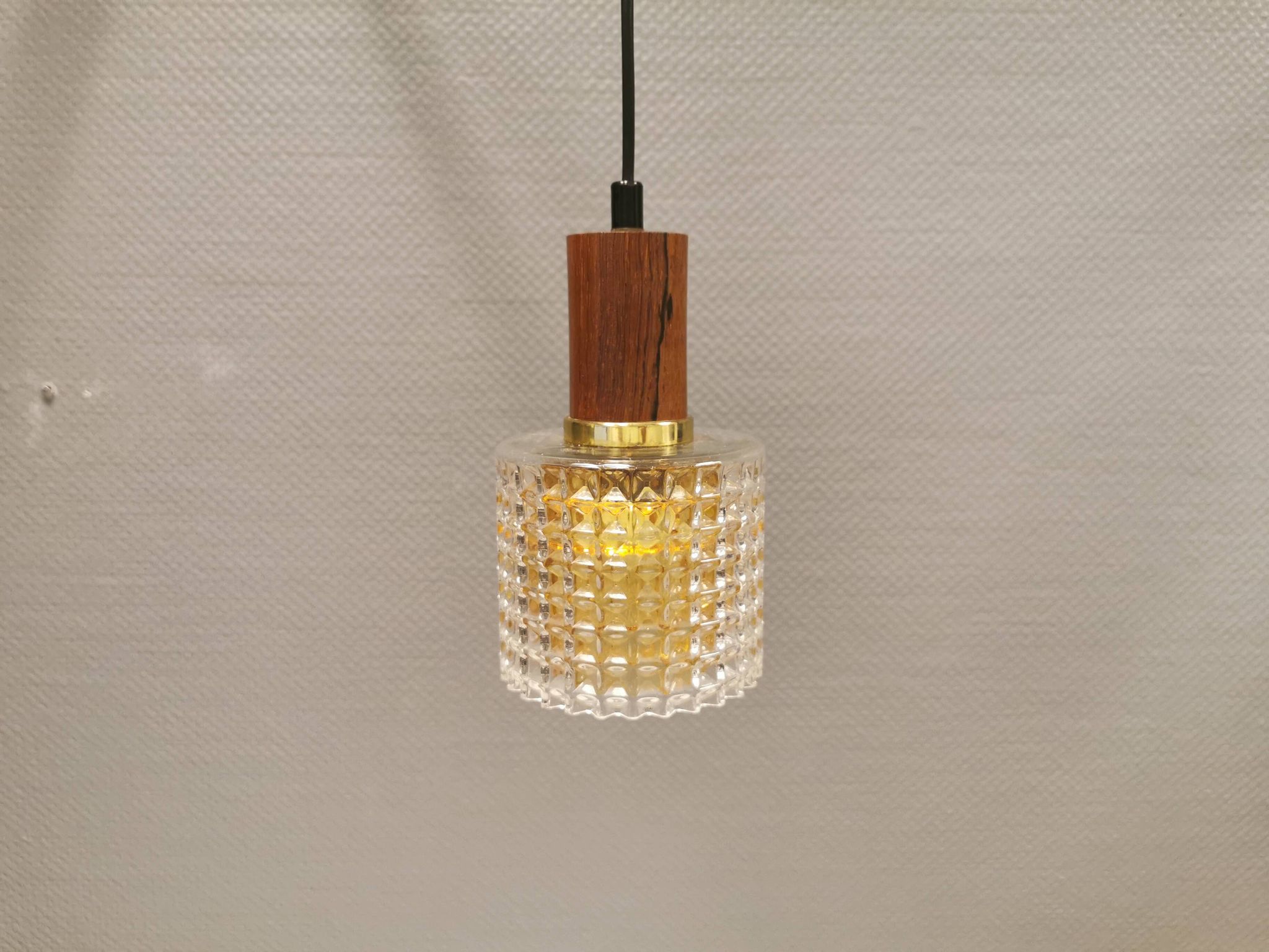 Older Swedish hanging lamp in multi-layered crystal glass with rosewood top and brass ring.
