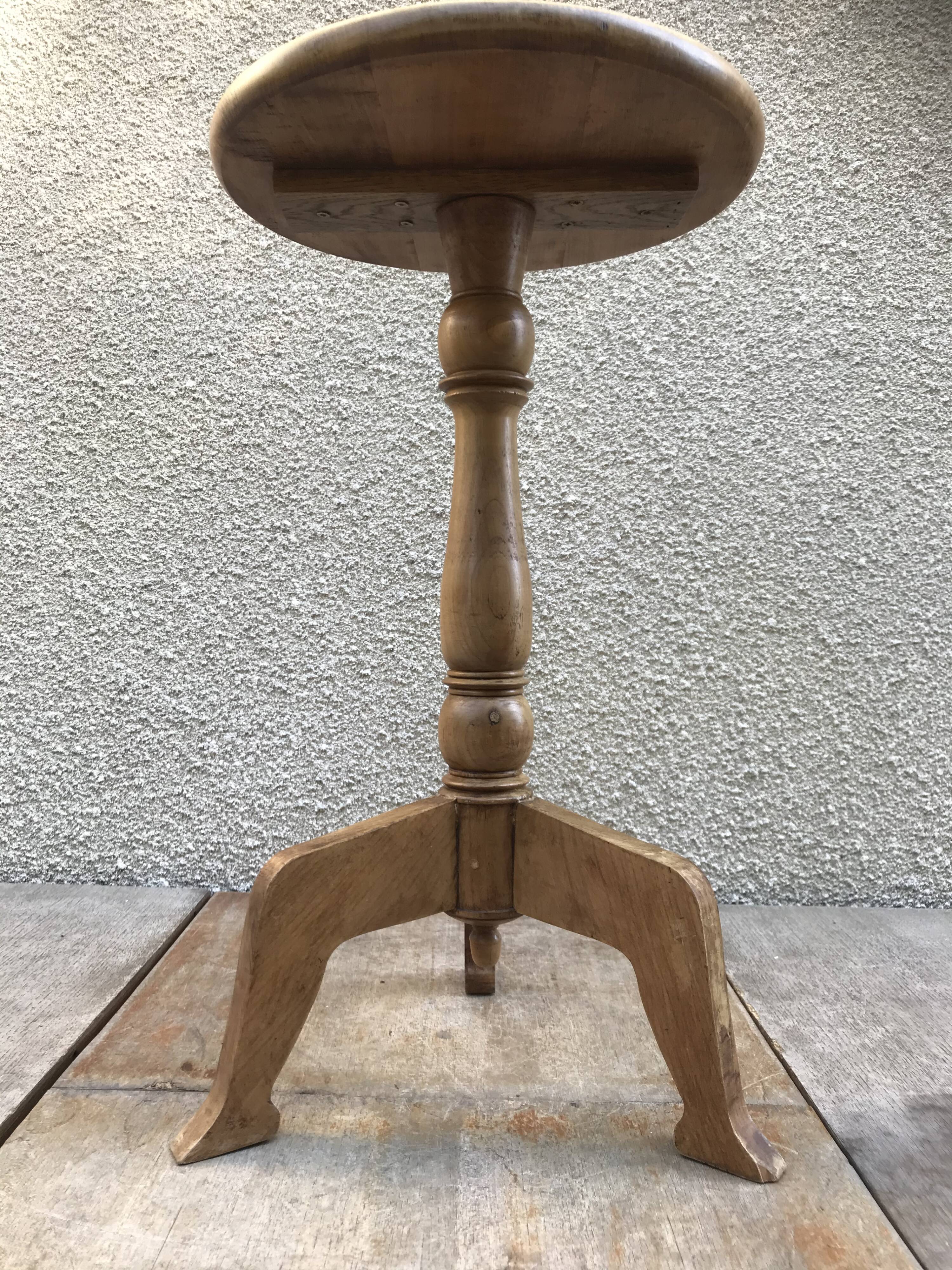 Old vintage wood tripode table