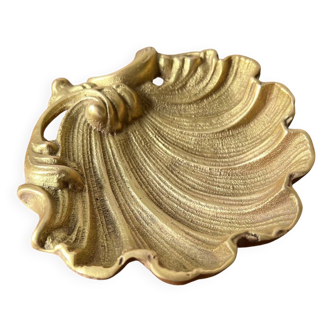 Bronze “shell” pocket emptier