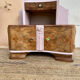 Art Deco bedside table in powder pink painted wood.