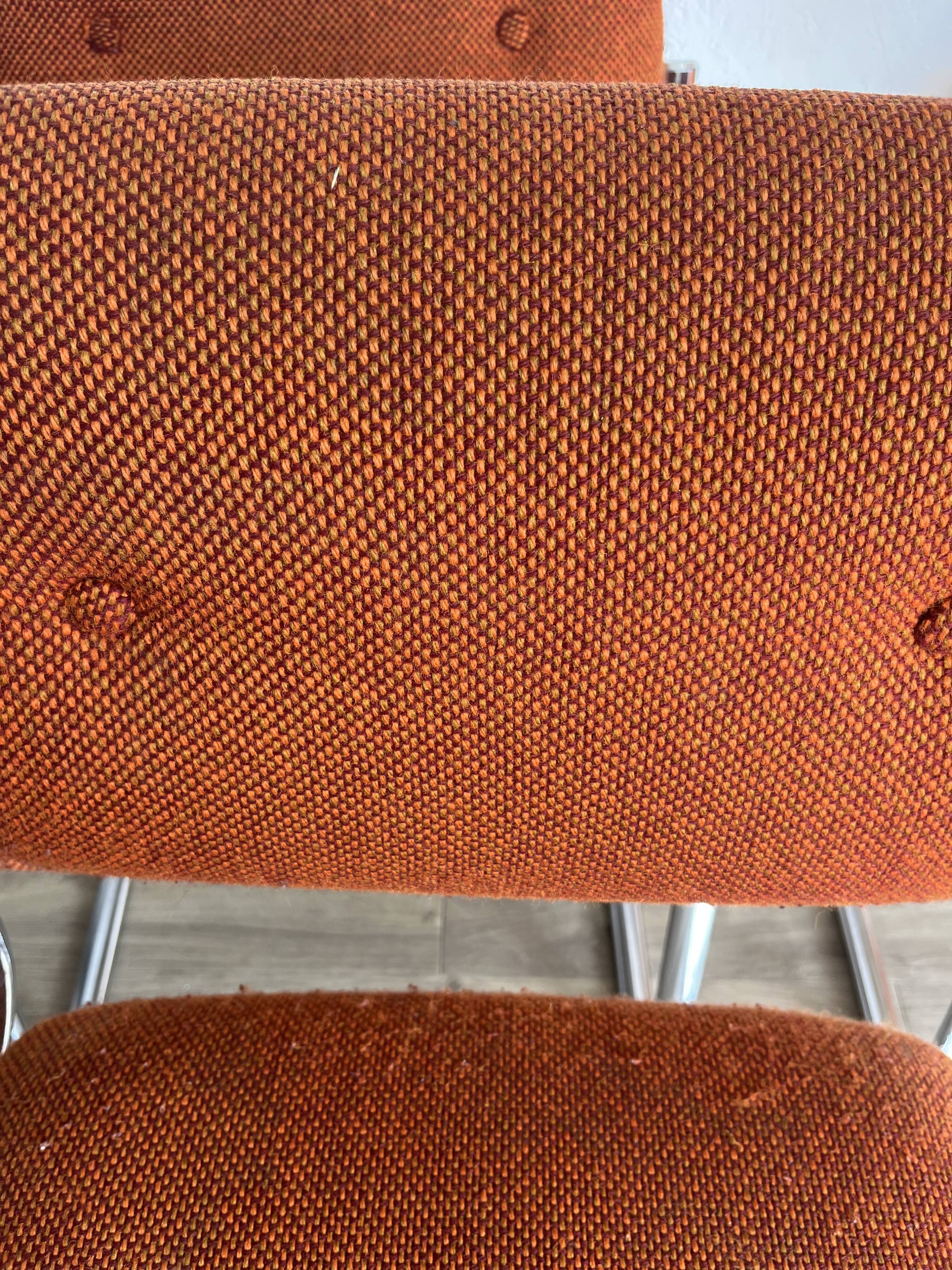 Vintage 70s orange tubular chairs
