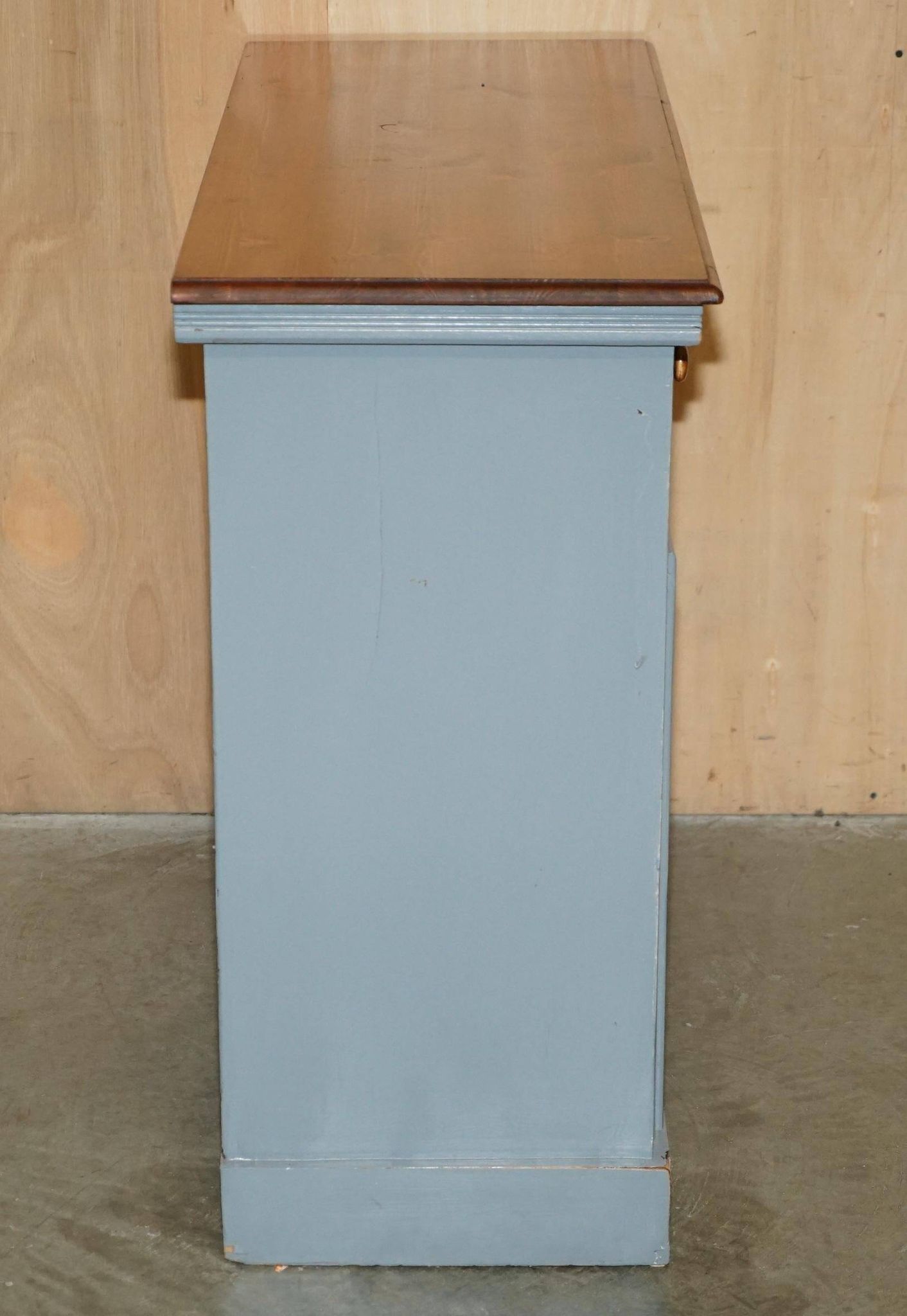 Vintage wooden furniture for 45 wine bottles with a drawer.