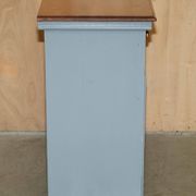 Vintage wooden furniture for 45 wine bottles with a drawer.