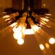 Radiant glass tube chandelier. Contemporary design.