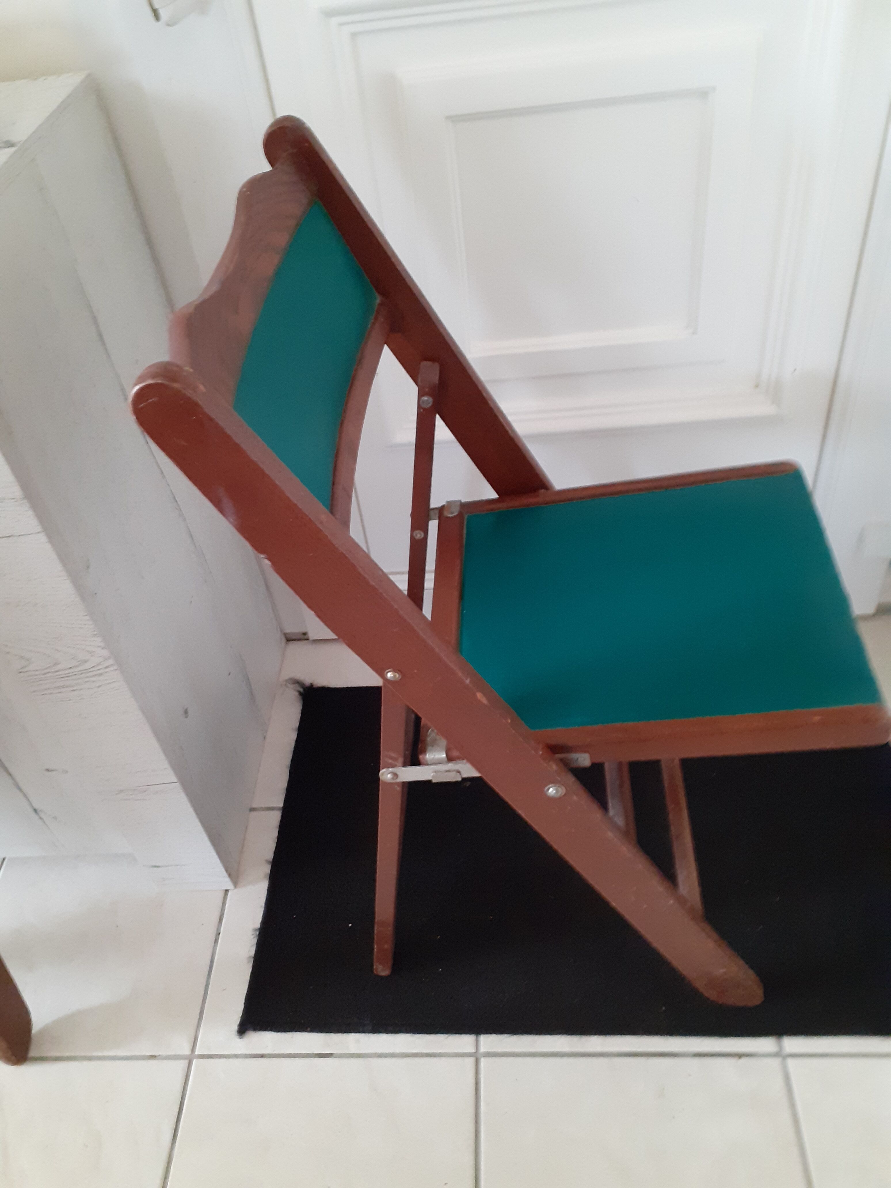 2 folding wooden and skai chairs, 60s