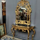 Mirror set with baroque style gilded wood console on marble top.