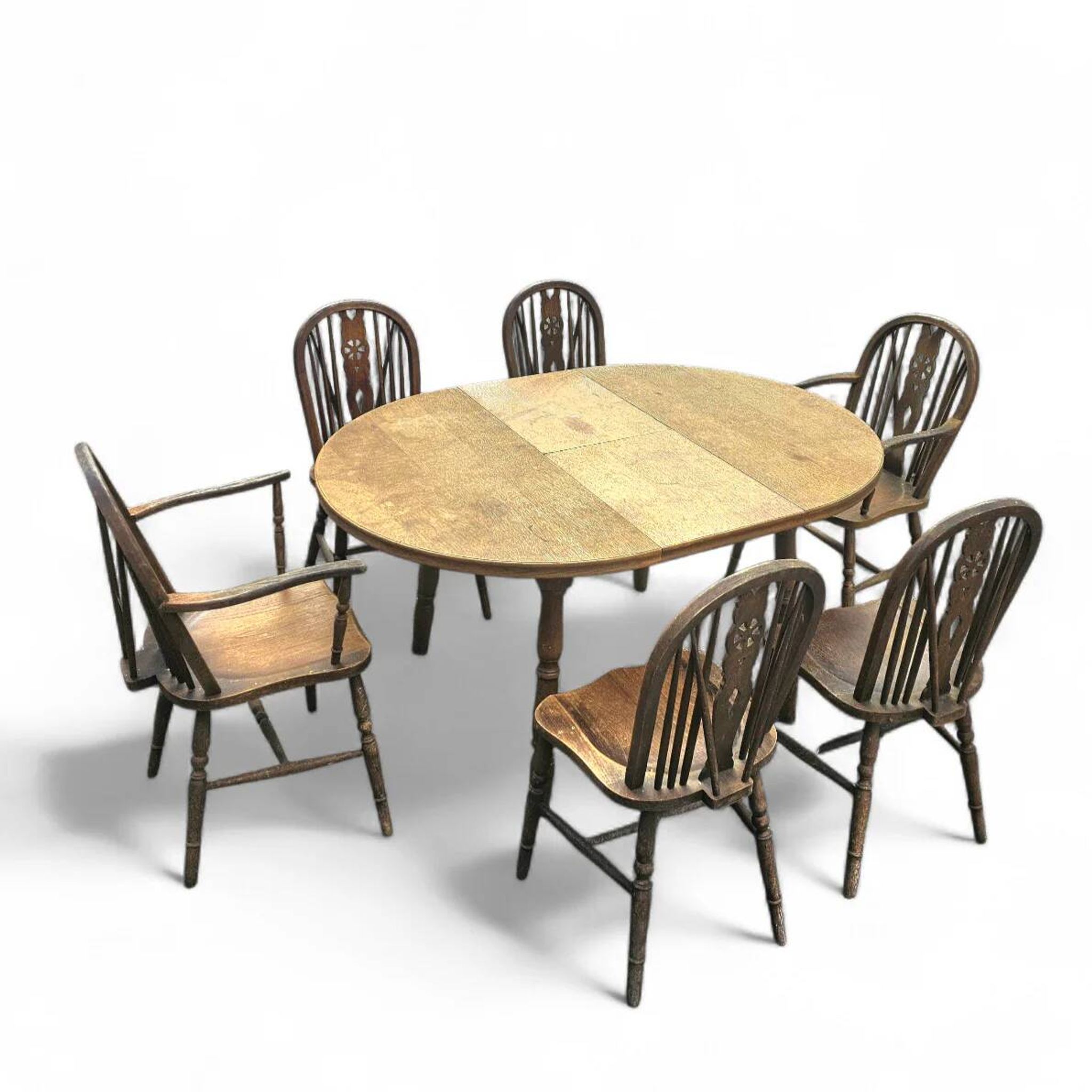 A slightly weathered Windsor wheelback dining set (7) by Oirschotse Meubelindustrie 1950s