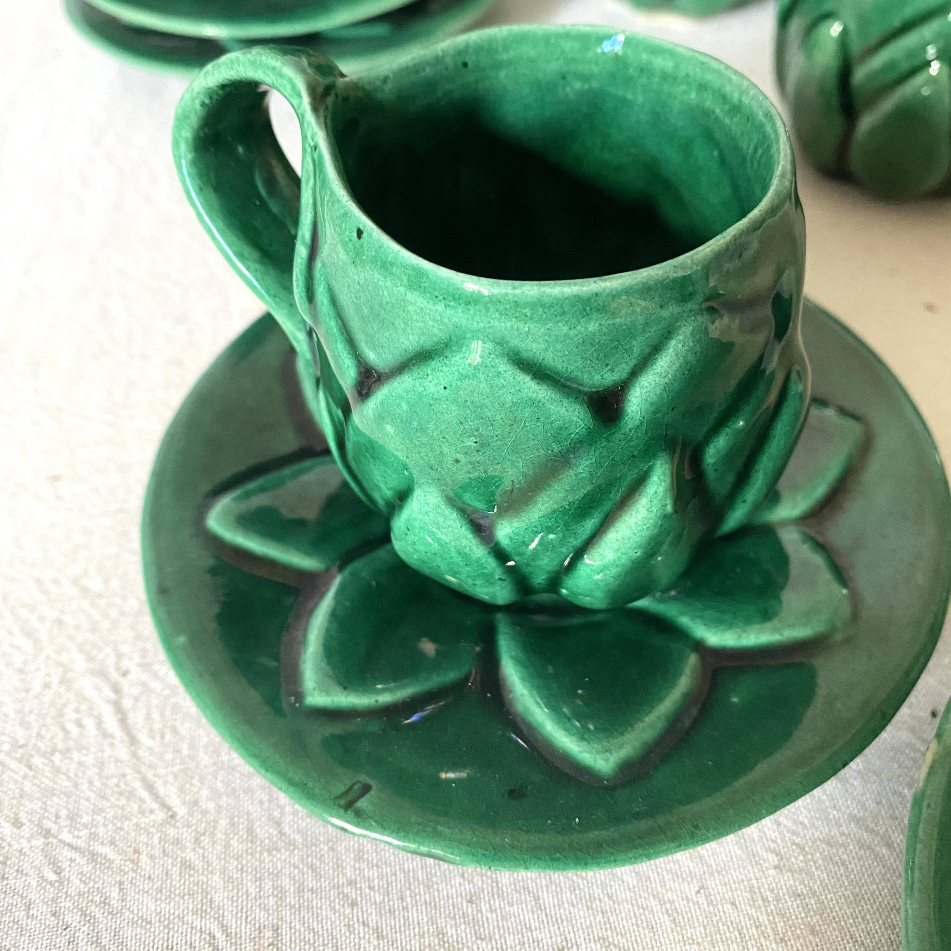 Antique slip cups with saucers, sugar bowl and milk pitcher