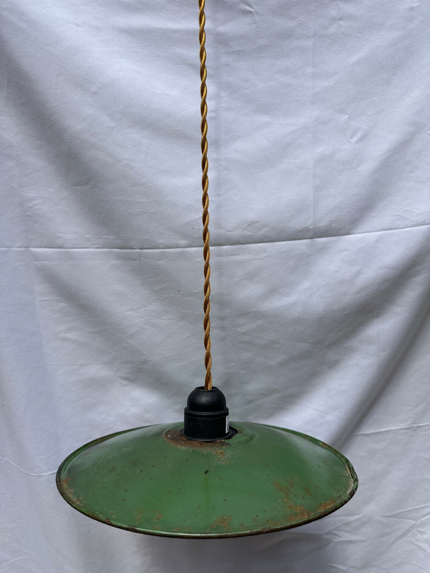 Old green and white enamelled sheet metal suspension