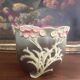 Antique cache-pot from the 1900s in majolica with a raised floral decoration in pink, very decorative.