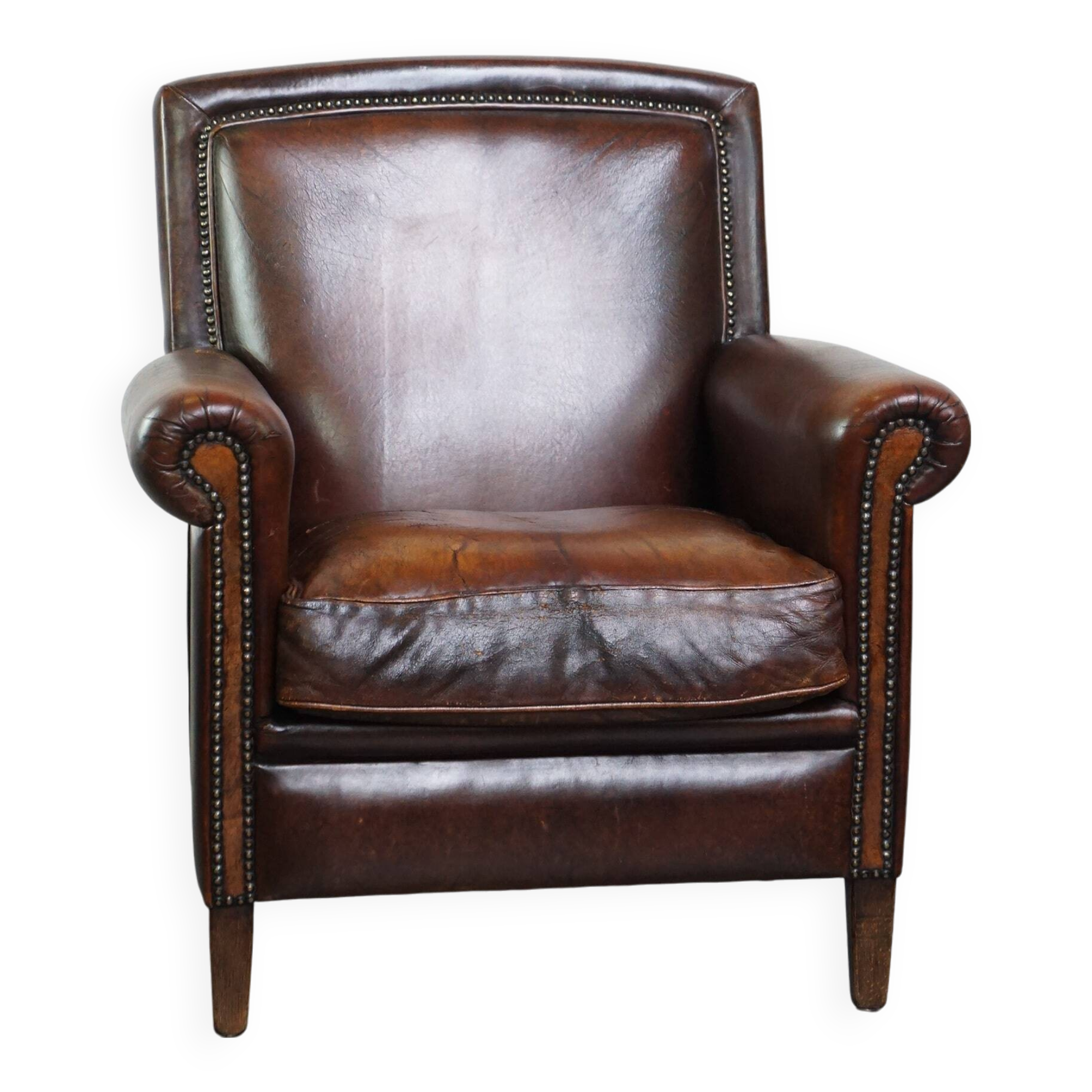 Vintage sheepskin armchair with beautiful warm colors and excellent seating comfort