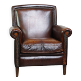 Vintage sheepskin armchair with beautiful warm colors and excellent seating comfort