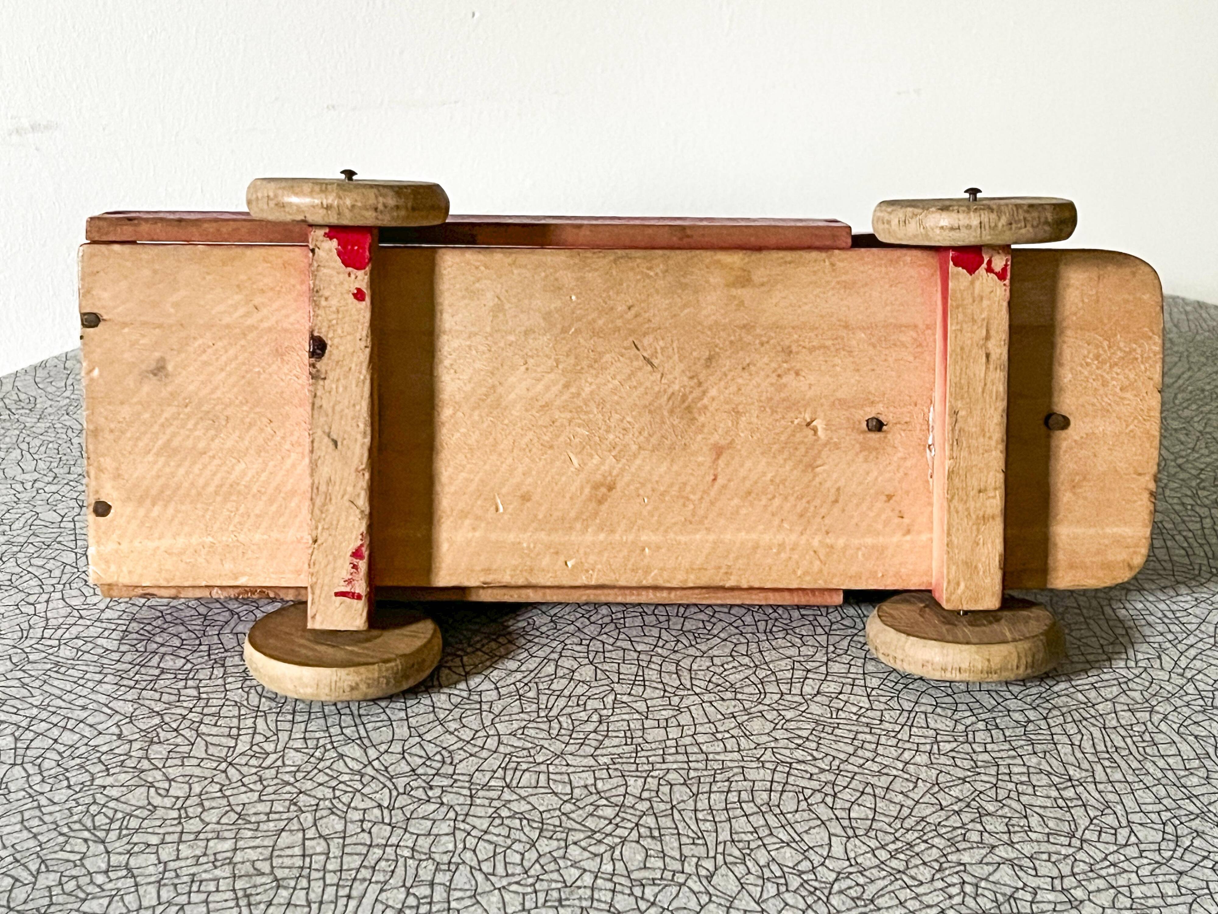 Red wooden flatbed truck, vintage toy