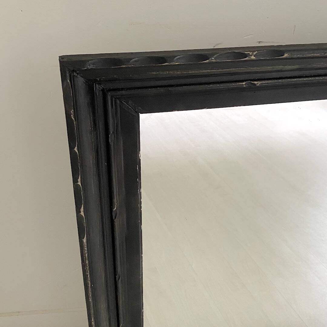 1950s mirror, matte black wood with a patina.