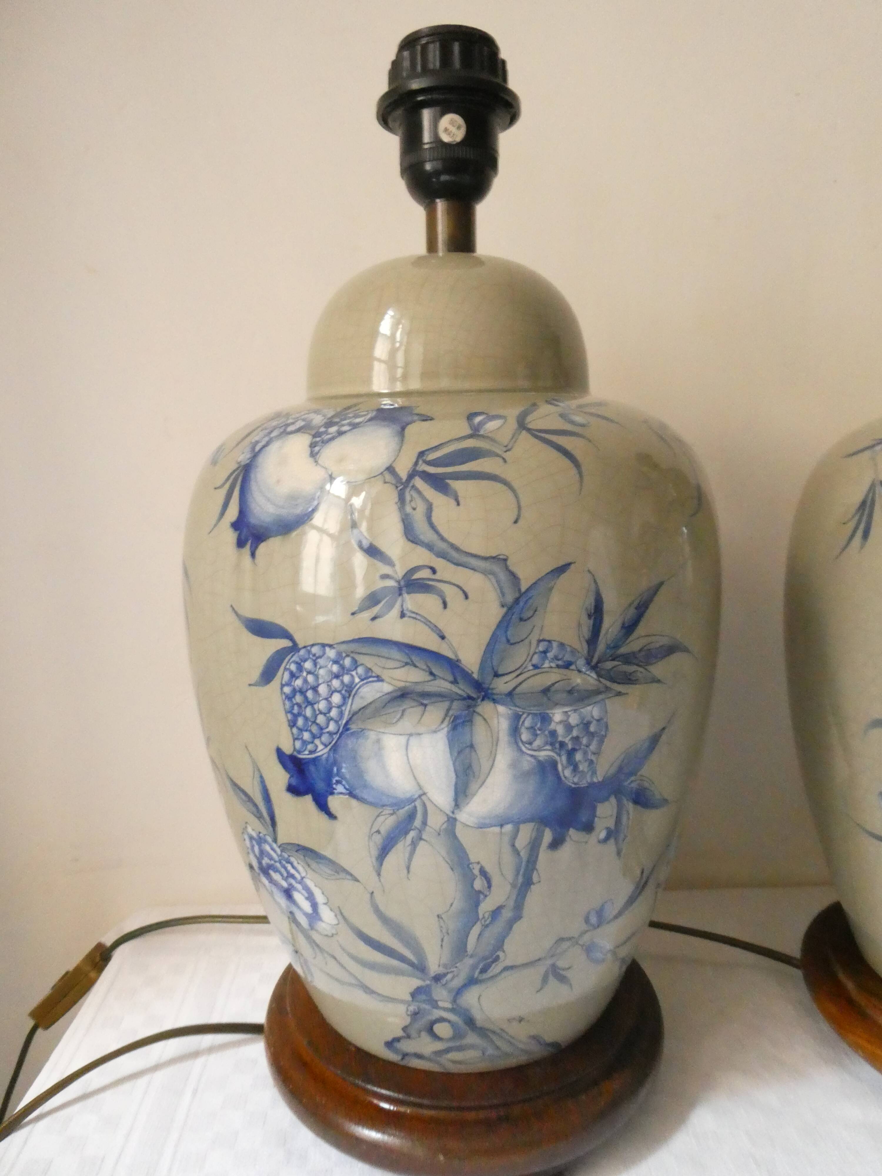 Pair of celadon crackle ceramic lamp bases decorated with flowers.