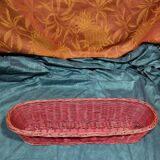 Old bread basket for baguette or red banneton in woven wicker