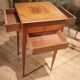 Nightstand with veneer and 4 drawers.