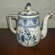 Henriot Quimper earthenware coffee set with floral decoration and elegant blue