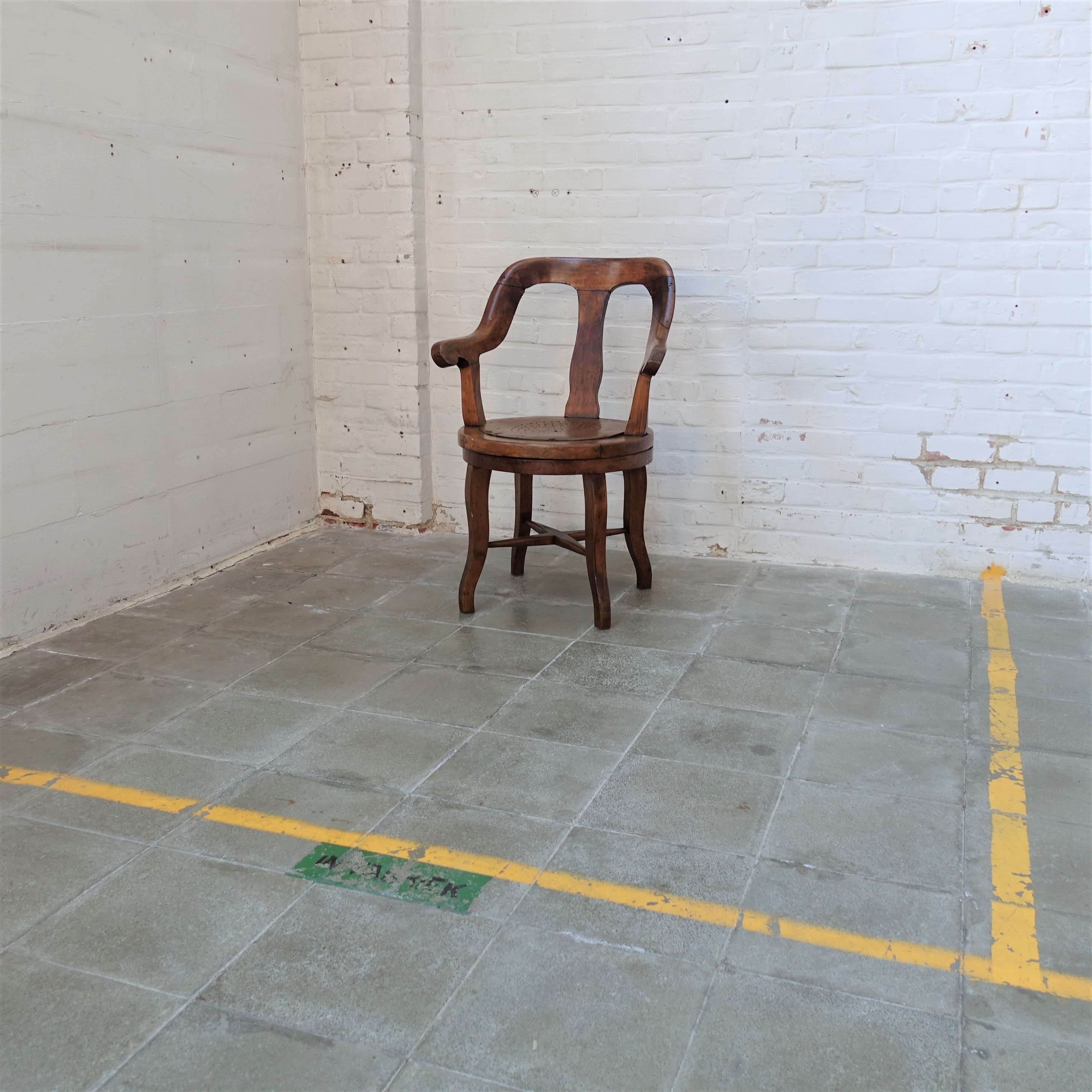 Antique oakwood barber armchair