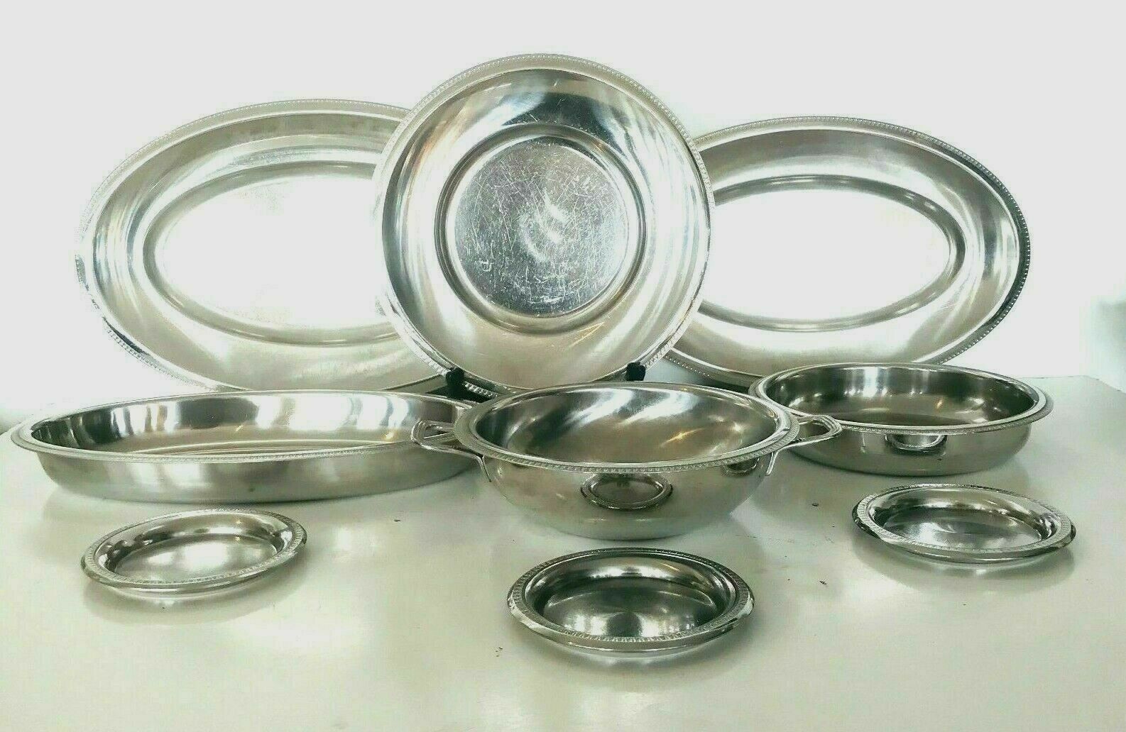 Lot of four dishes and two silver metal steels Maison Royal BB France