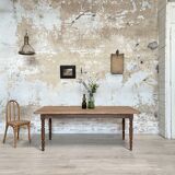 Vintage farmhouse table with turned legs.