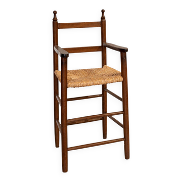 High chair made of straw and wood