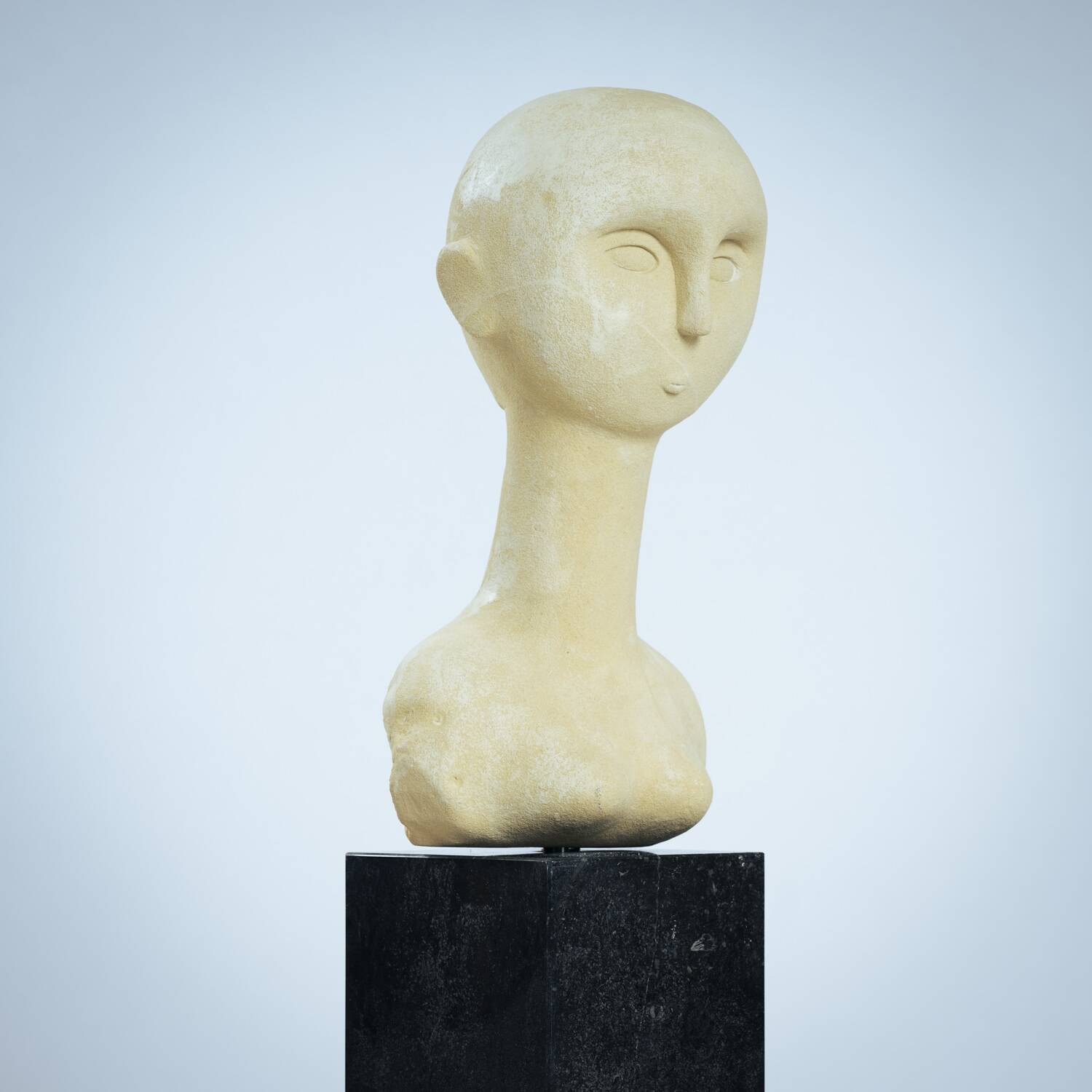 Modernist bust sculpture of a woman in sandstone